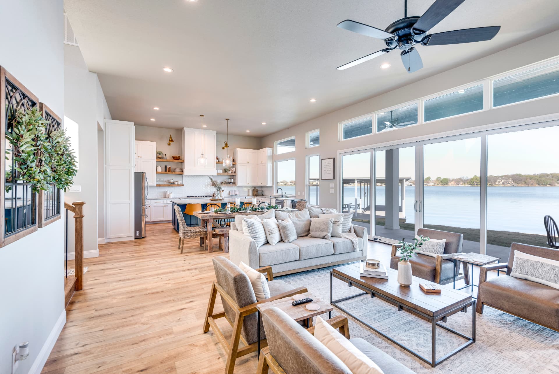Living room framed by large glass sliding doors onto the lake