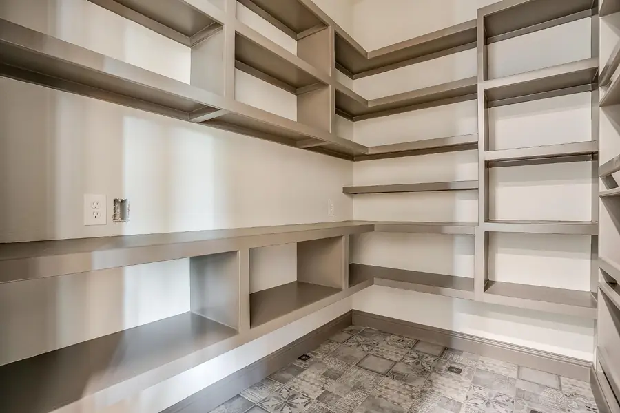 Pantry shelving and patterned tile detail