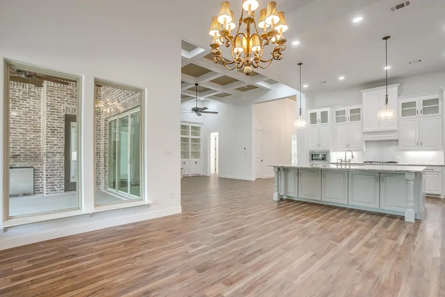Open-concept view of the kitchen, dining, and living areas