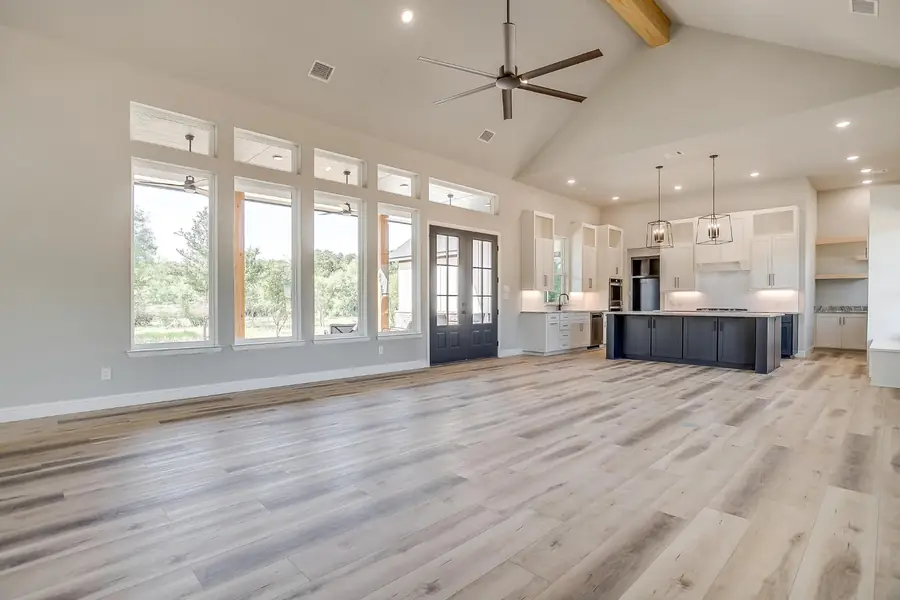 Living area with a bank of windows beneath the gabled ceiling