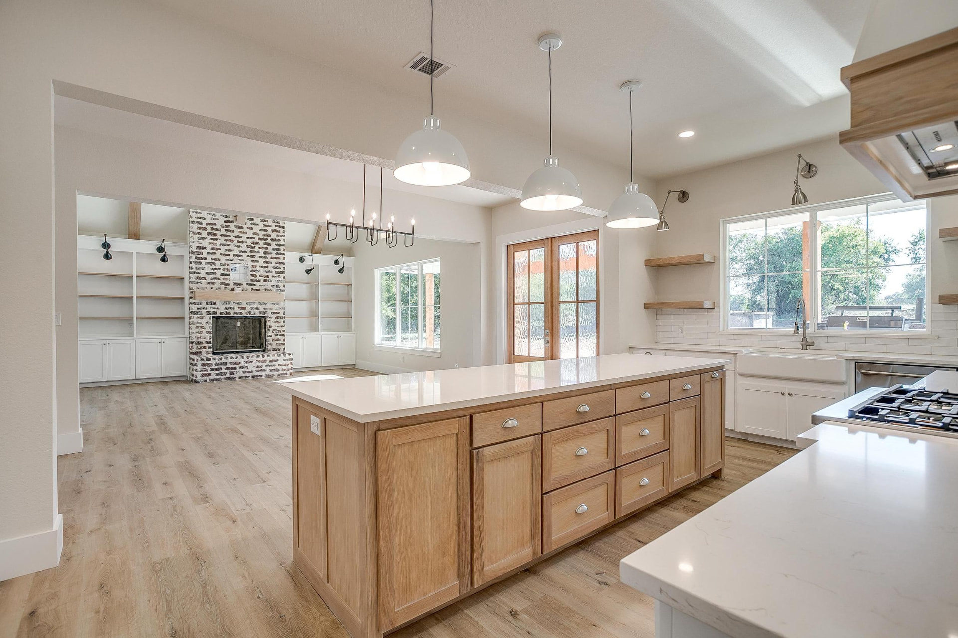 Wide kitchen view with the island opening to the living room