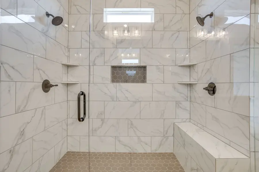 Walk-in shower with dual shower heads