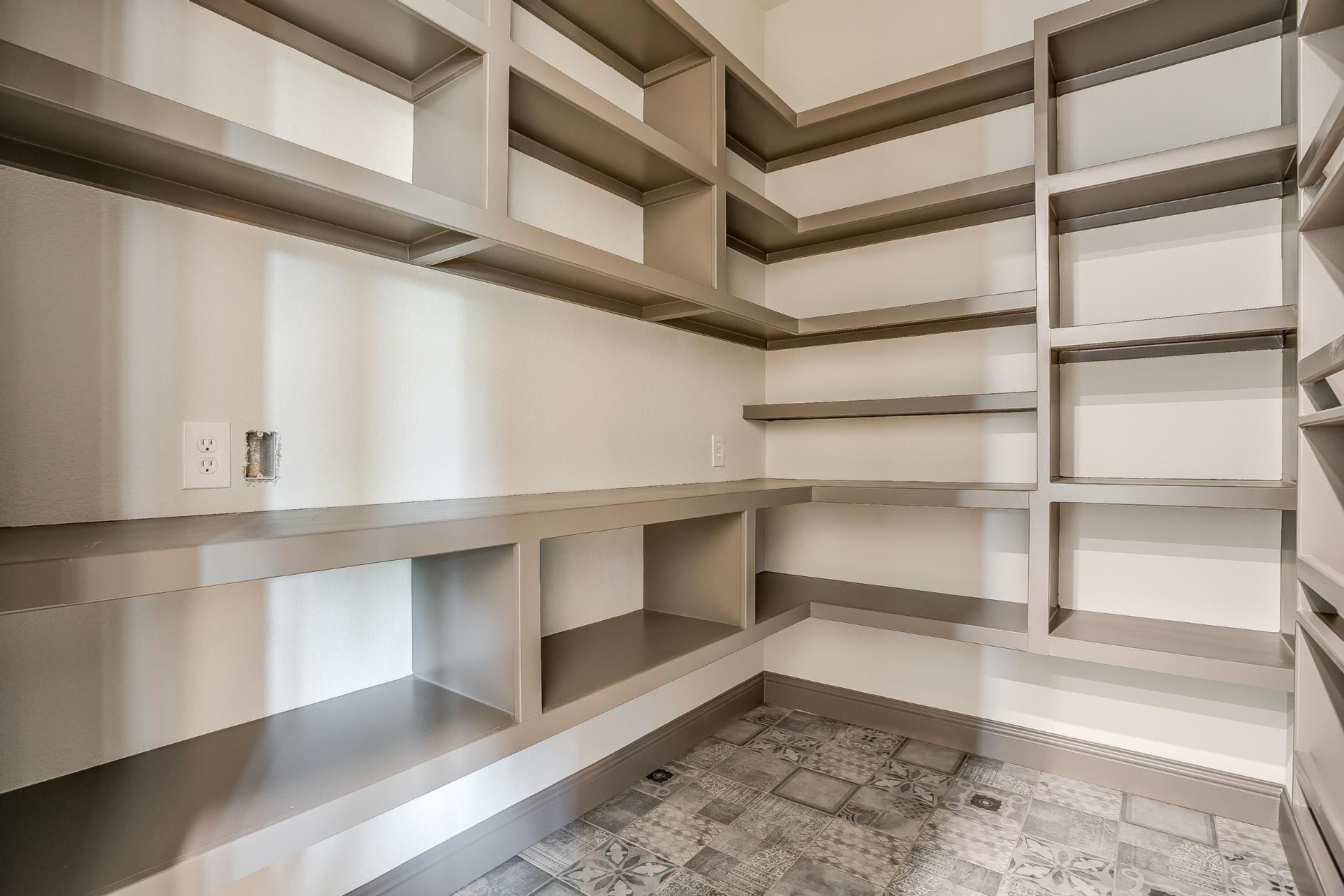 Pantry shelving and patterned tile detail