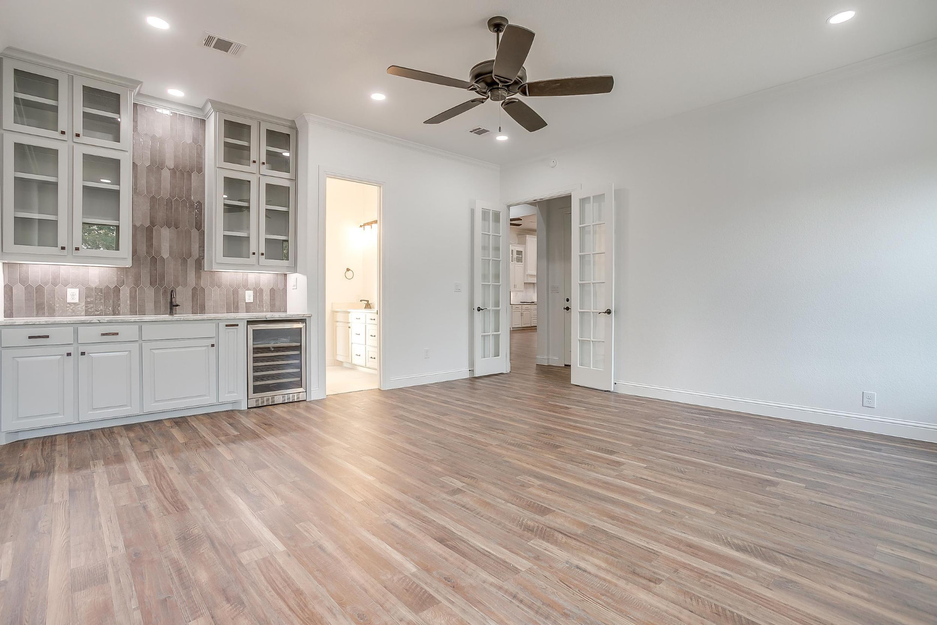 Living area with French doors beside the wet bar