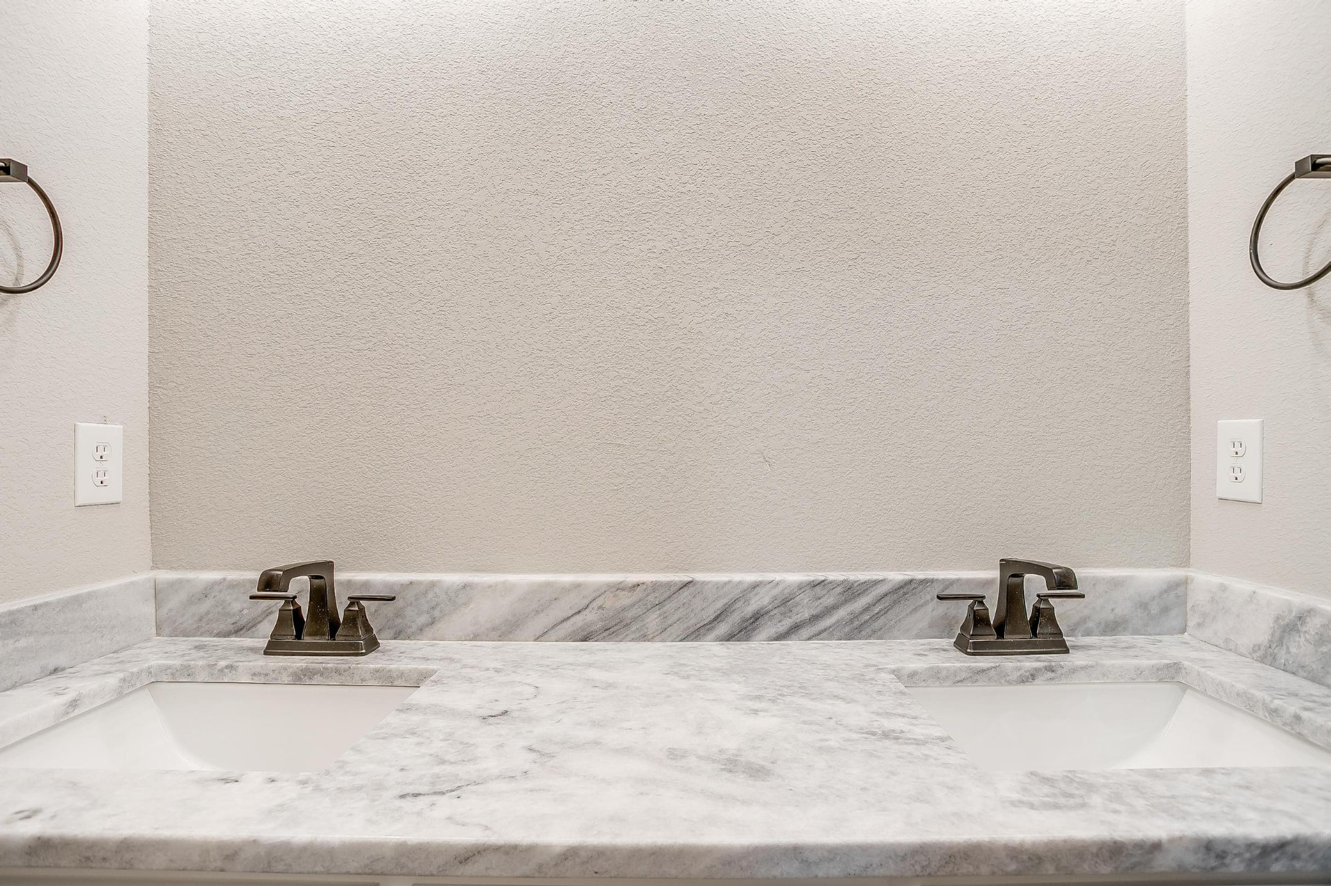 Double sinks and marble countertop in the guest bath