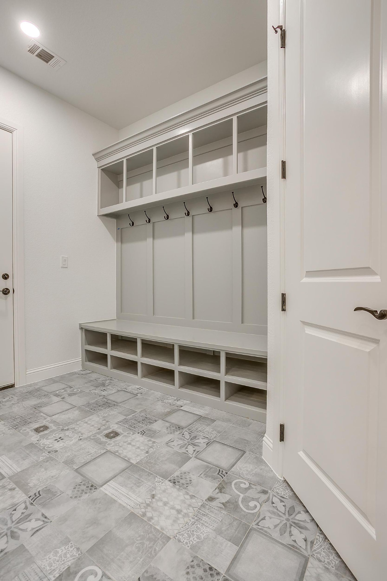 Mudroom built-ins and patterned floor tile detail