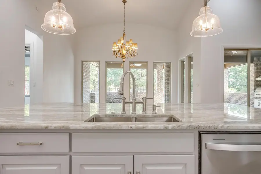 Kitchen sink looking out to large rear windows
