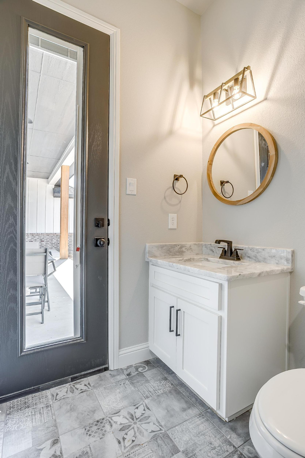 Powder room with door to the covered patio