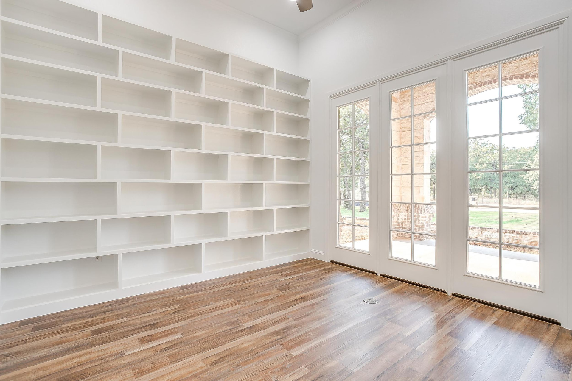Study with custom built-in bookcases and natural light