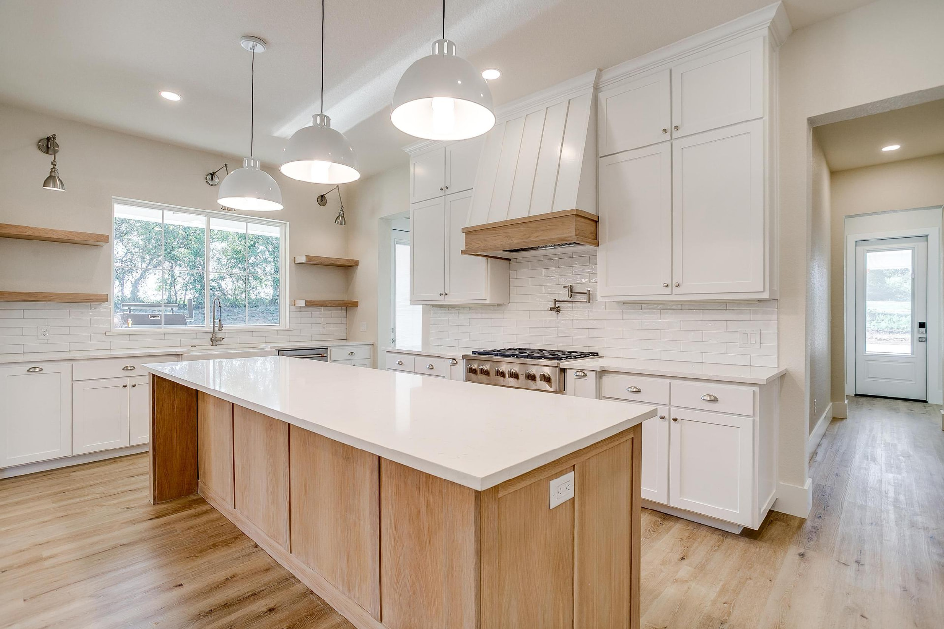 Kitchen workflow from island to range and pantry hallway