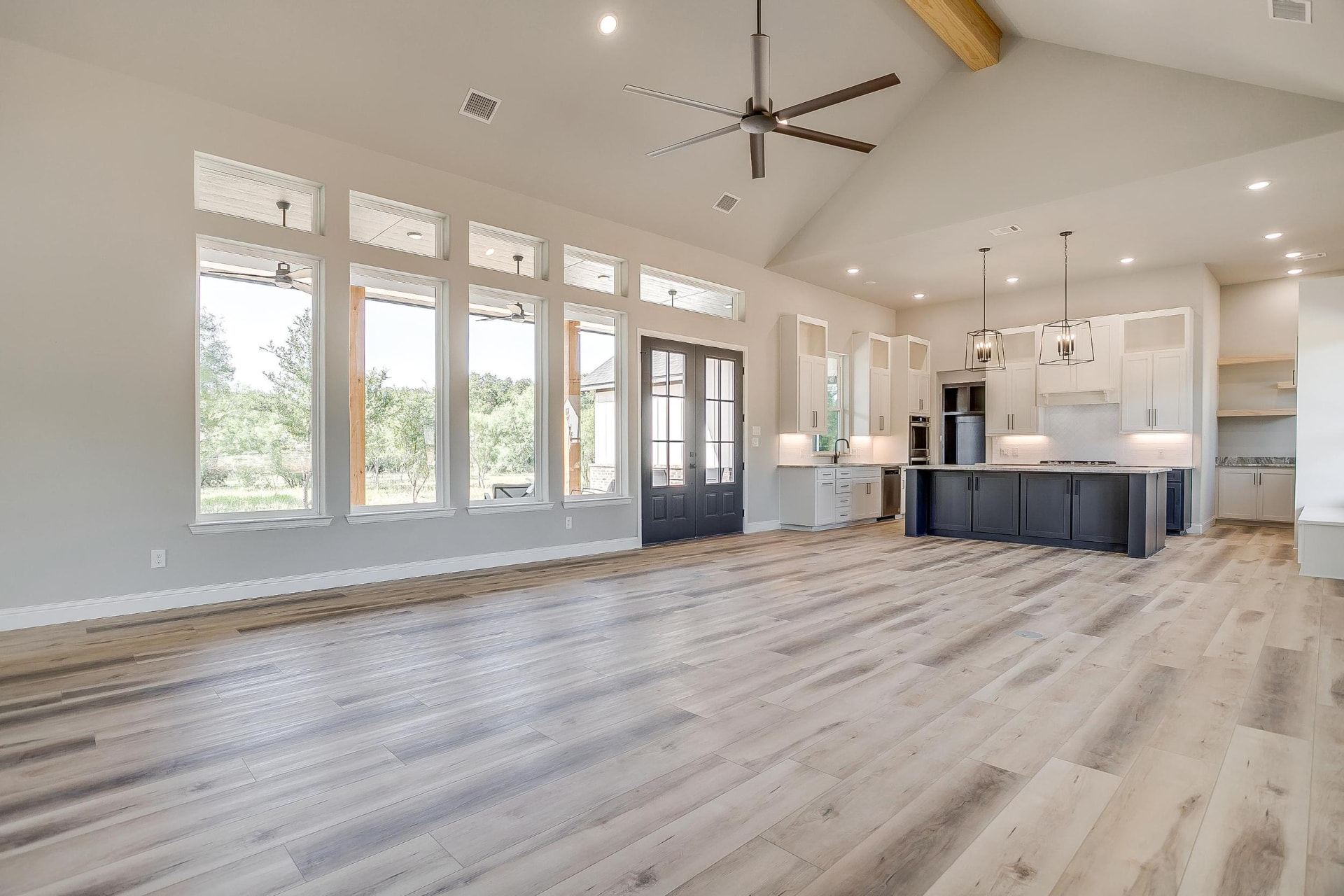Living area with a bank of windows beneath the gabled ceiling