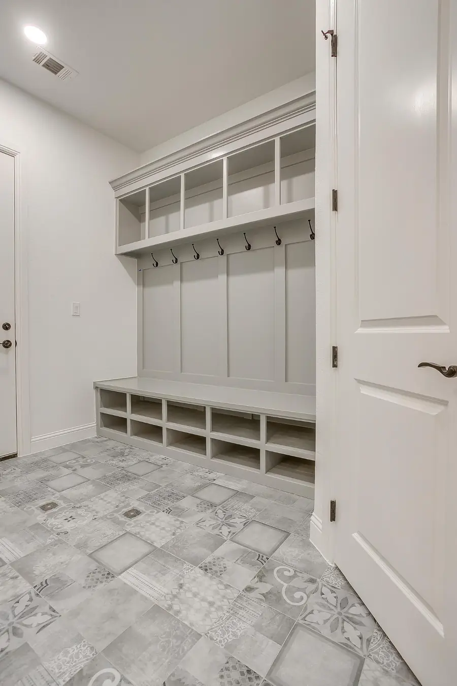 Mudroom built-ins and patterned floor tile detail