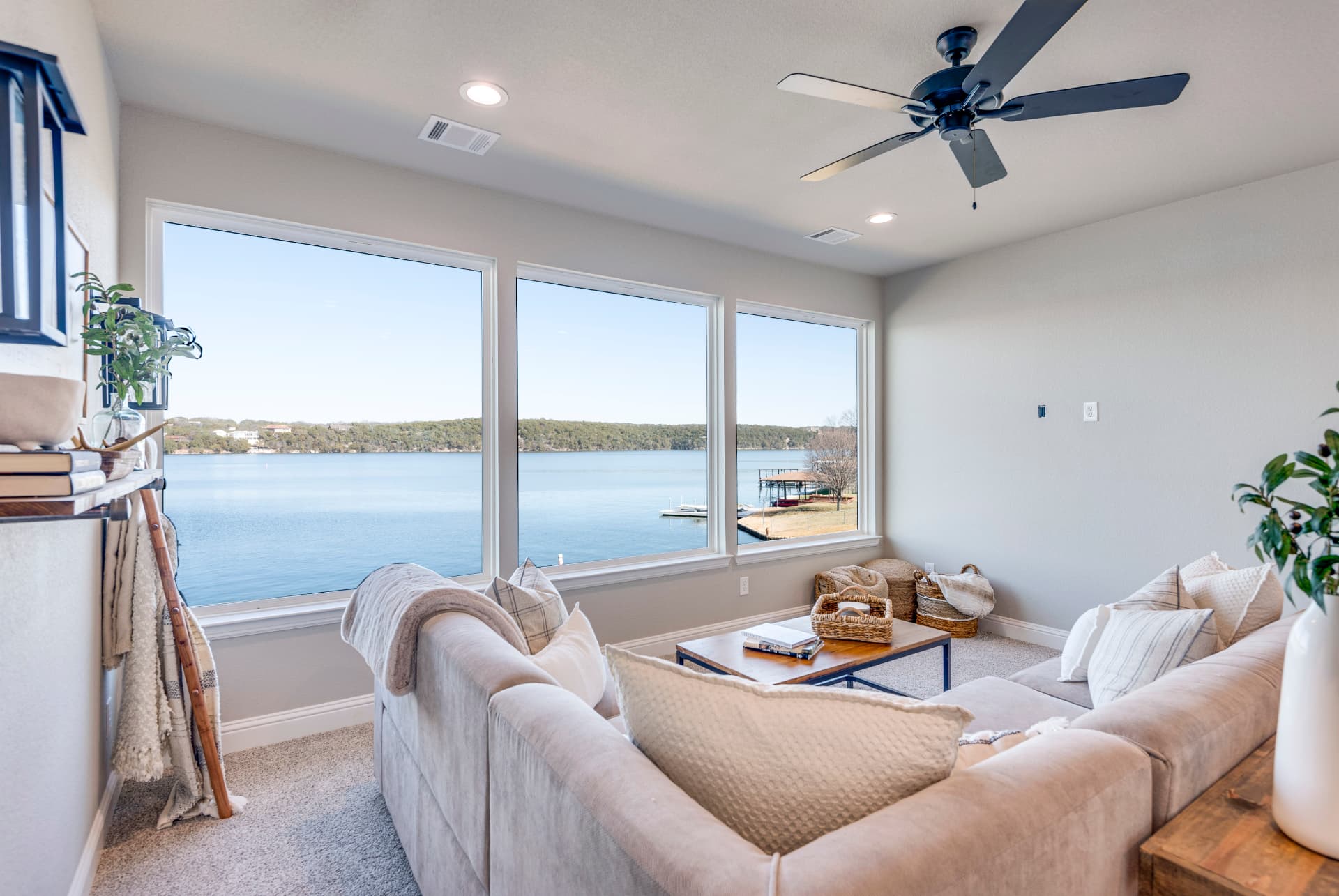 Wall of windows in the upstairs lounge overlooking the water