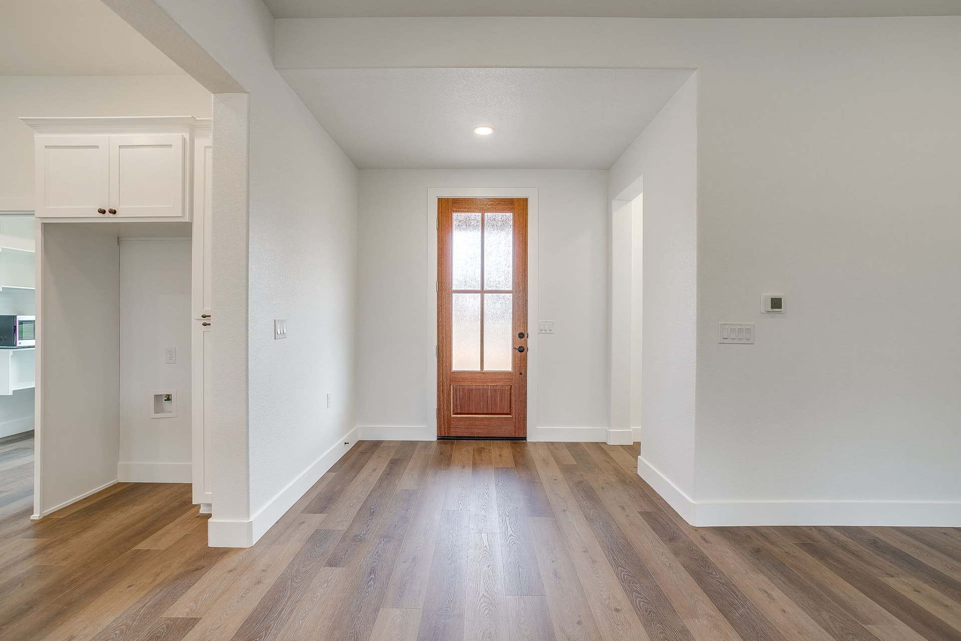 Open-concept great room with vaulted ceiling in the Wicker Way custom home