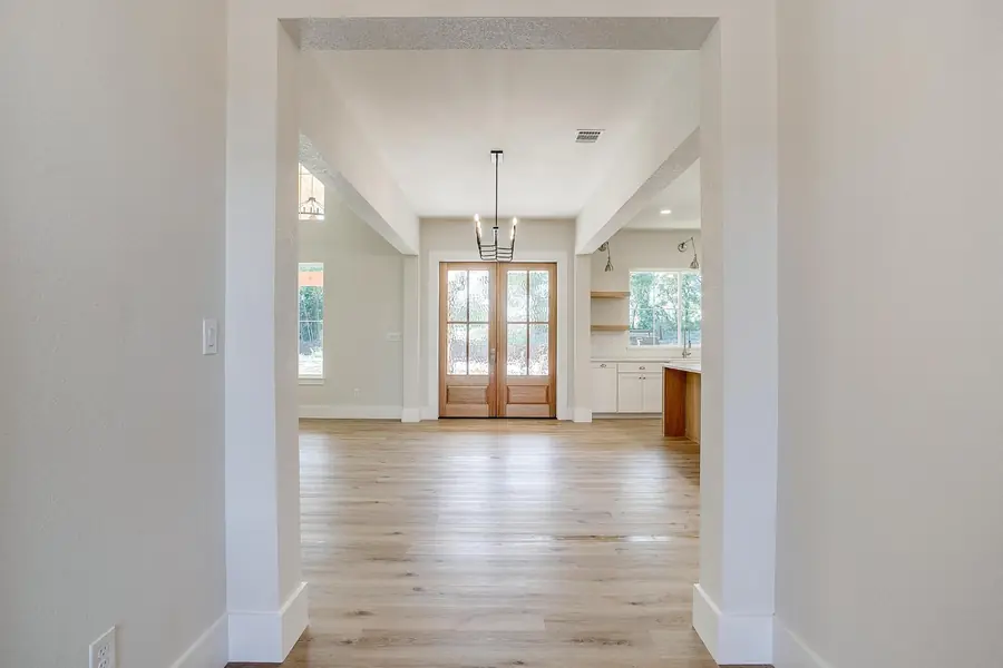 Foyer looking into the open-concept living area and kitchen