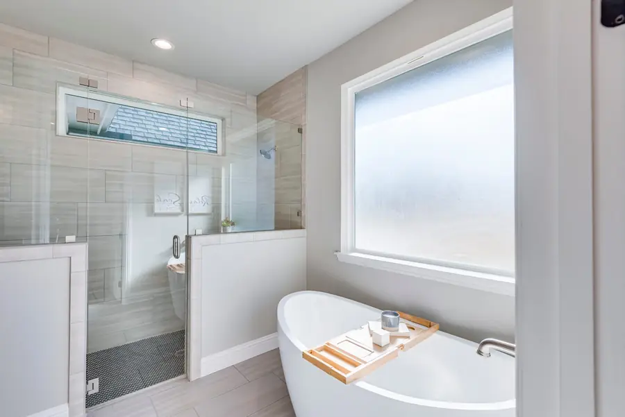 Primary bath with freestanding tub and glass walk-in shower