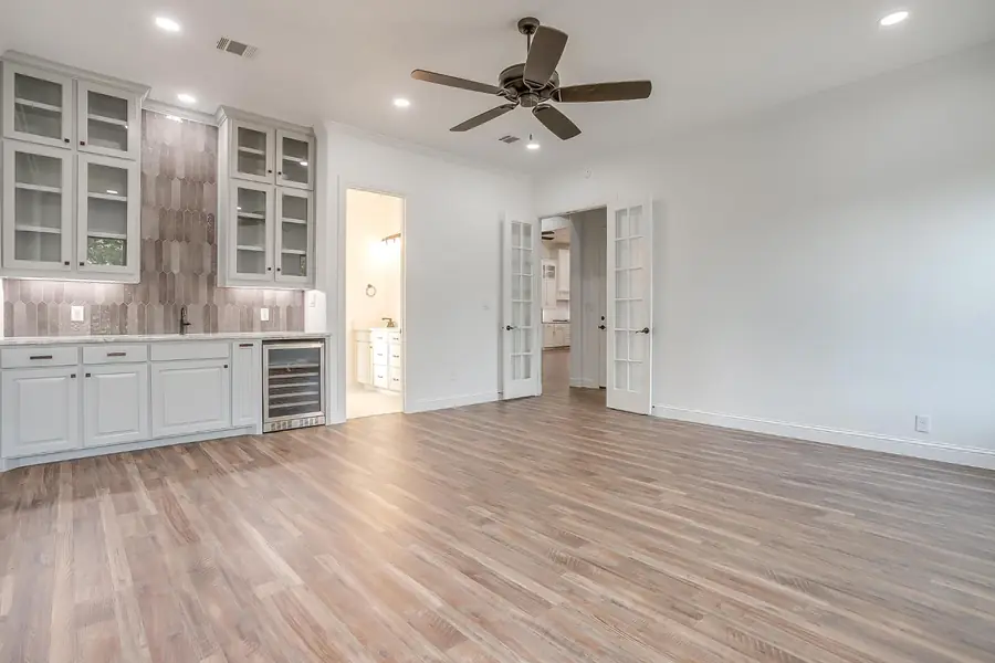 Living area with French doors beside the wet bar