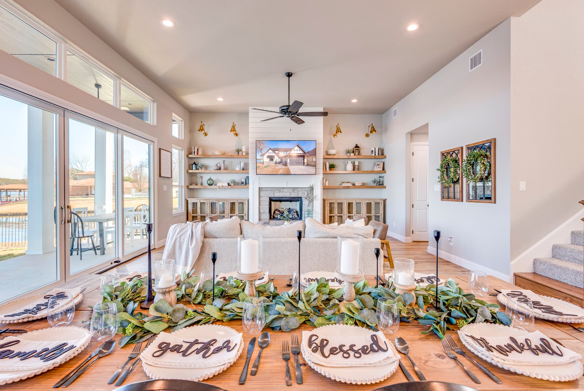 Vaulted living room filled with natural light from the dining side