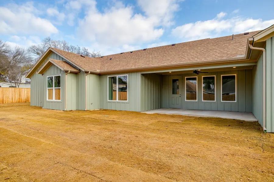 Rear exterior of the Wicker Way custom home with covered patio and board-and-batten siding