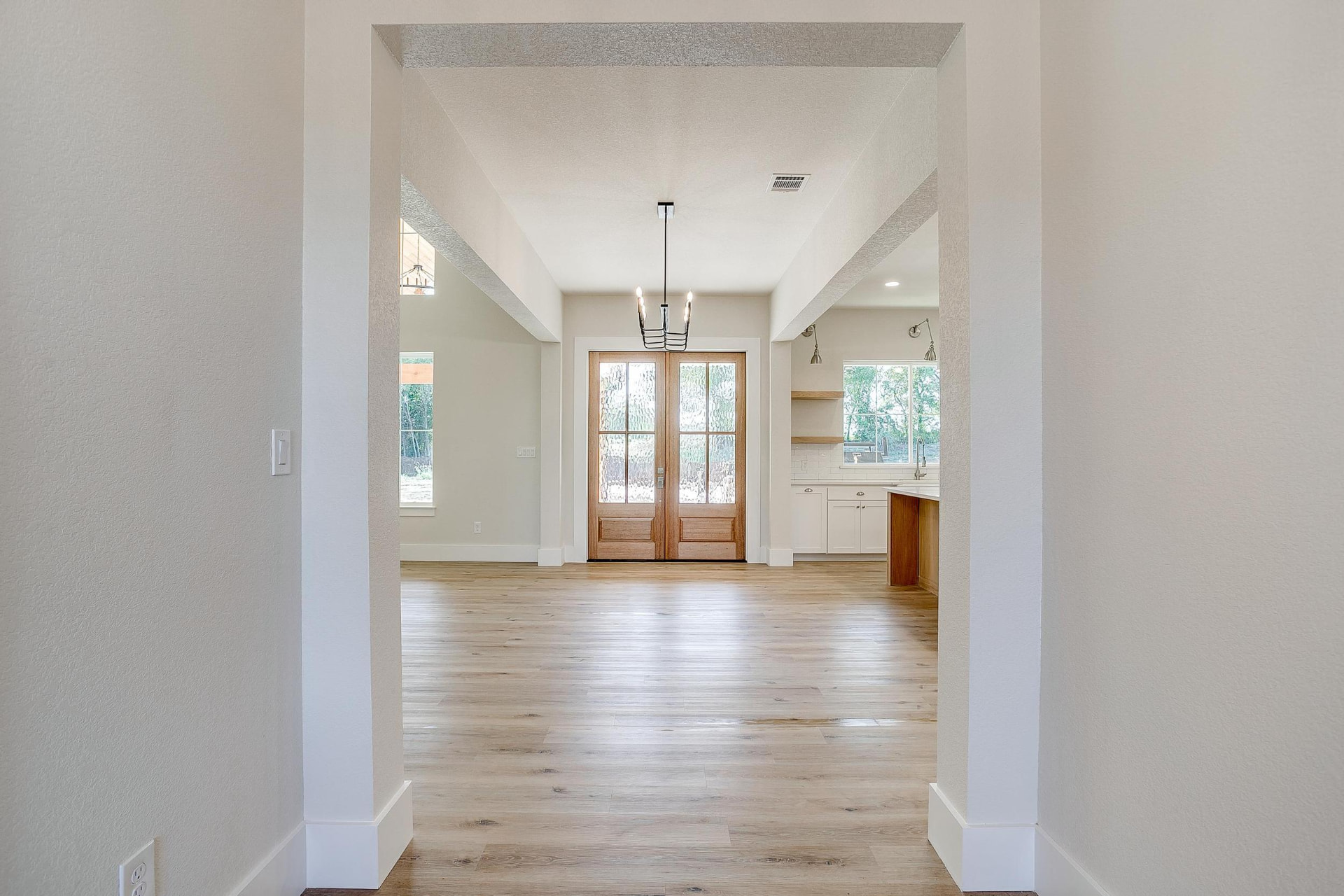 Foyer looking into the open-concept living area and kitchen