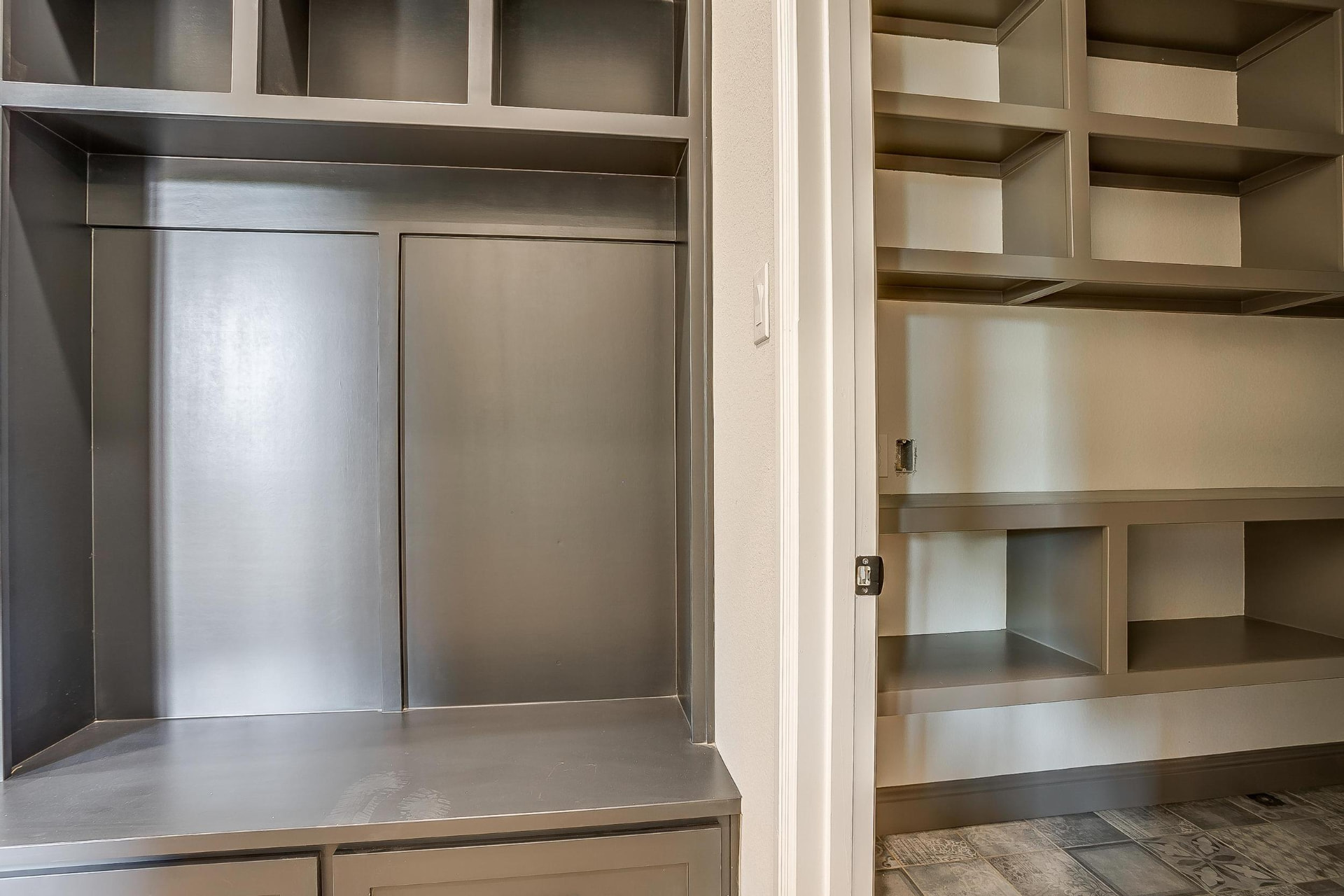 Dark gray built-in cubbies and shelving