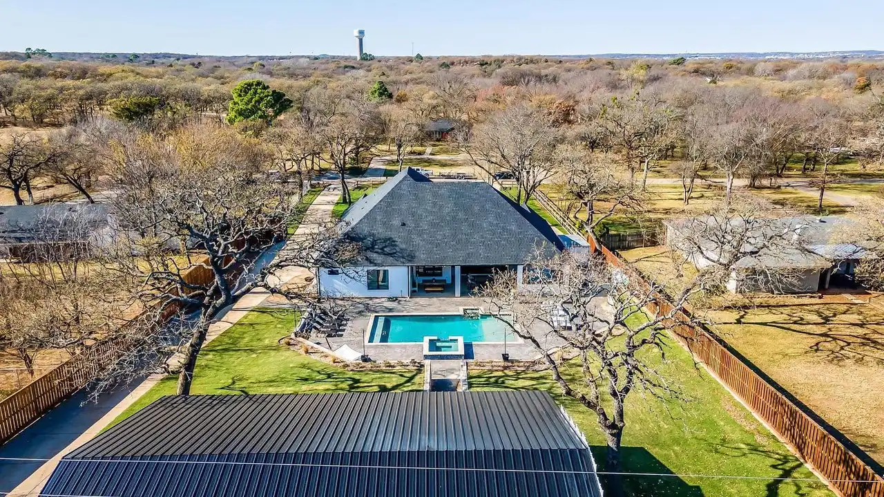 Aerial view of a completed custom estate home with pool built by Taylor Homes