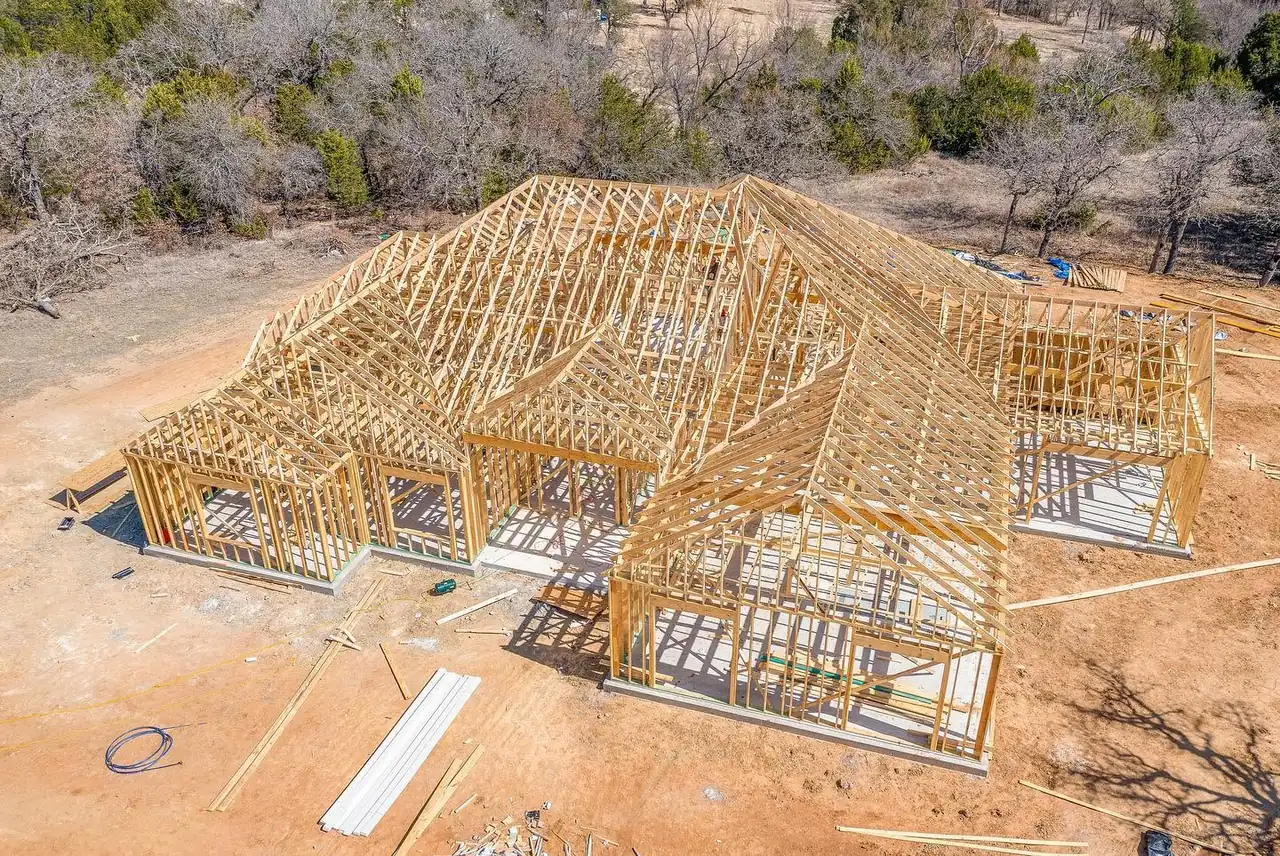 Aerial view of a custom home in framing stage built by Taylor Homes